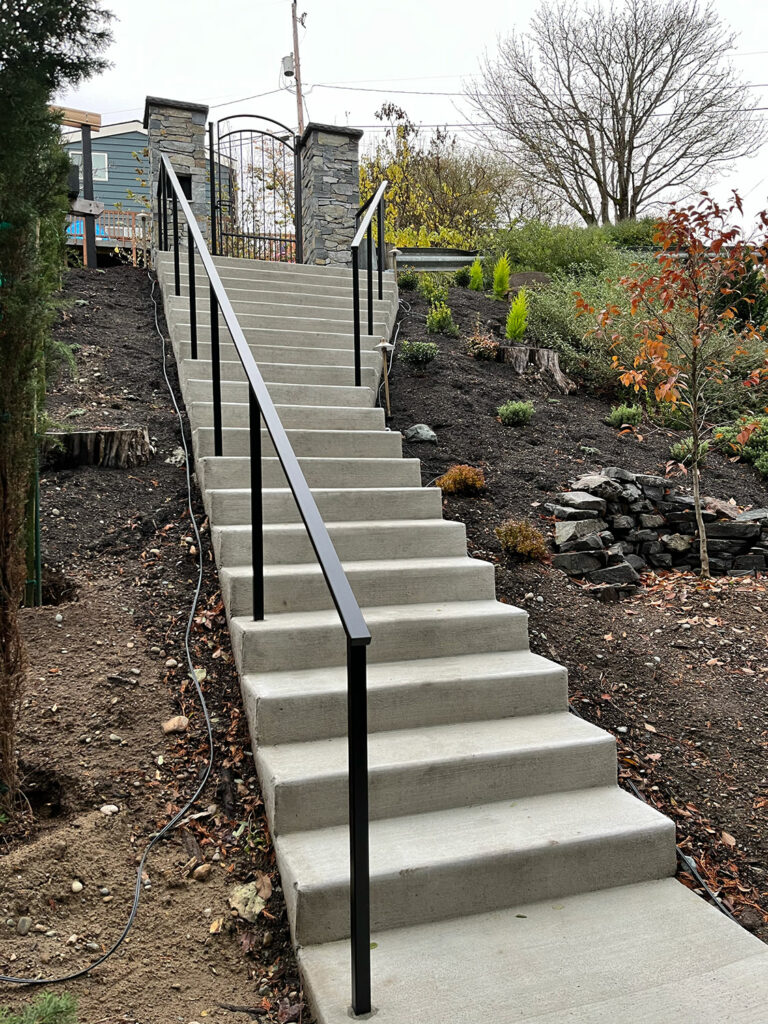 Multiple hand railings for new concrete steps - from bottom